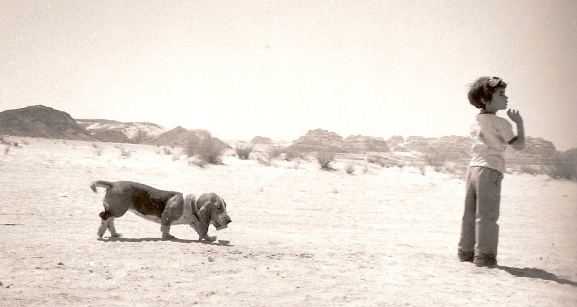 boy and dog in the desert